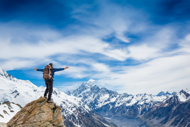 Standing atop mountain